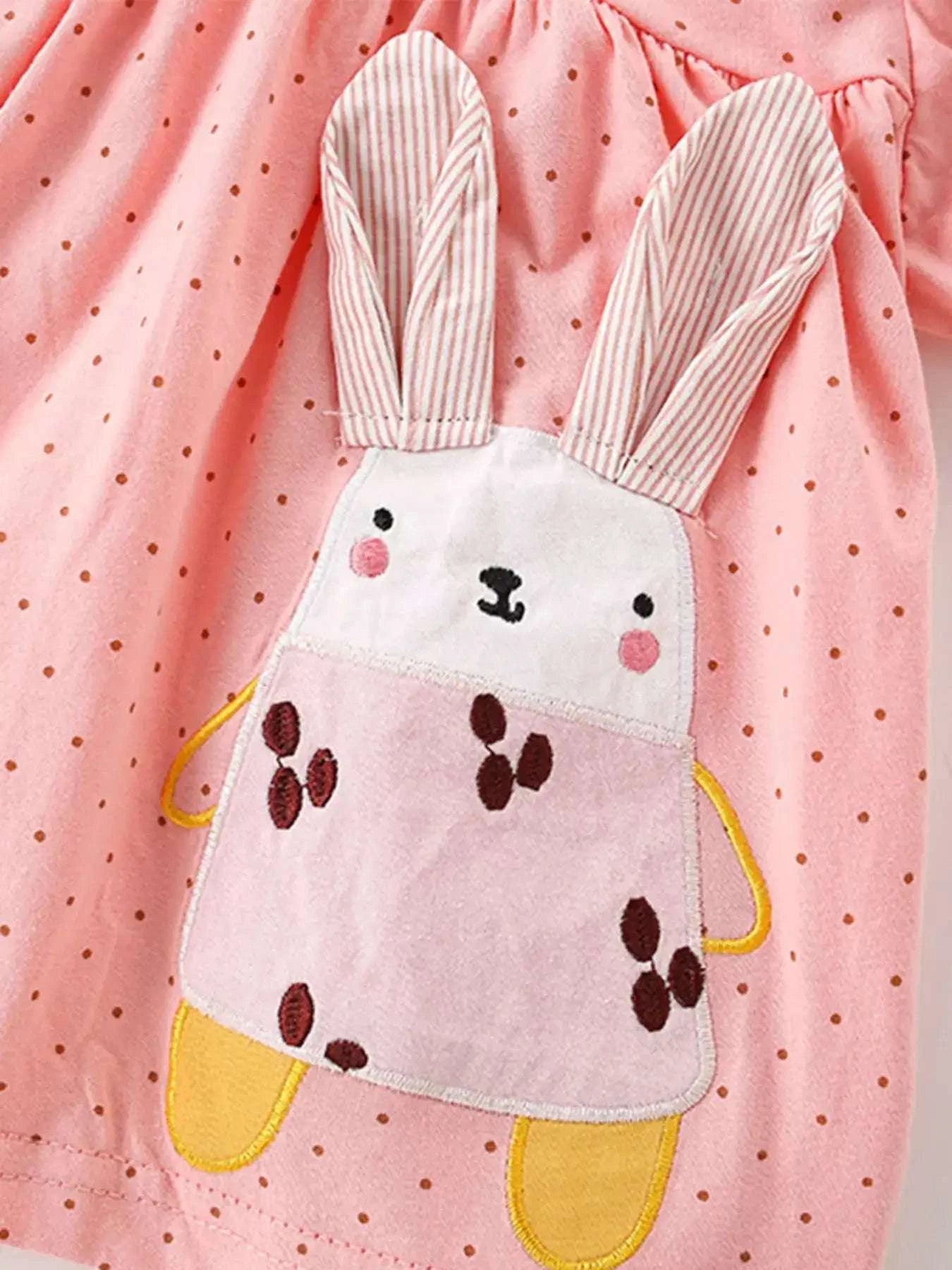 Dusty pink polka dot top with bunny face applique and striped long ear details