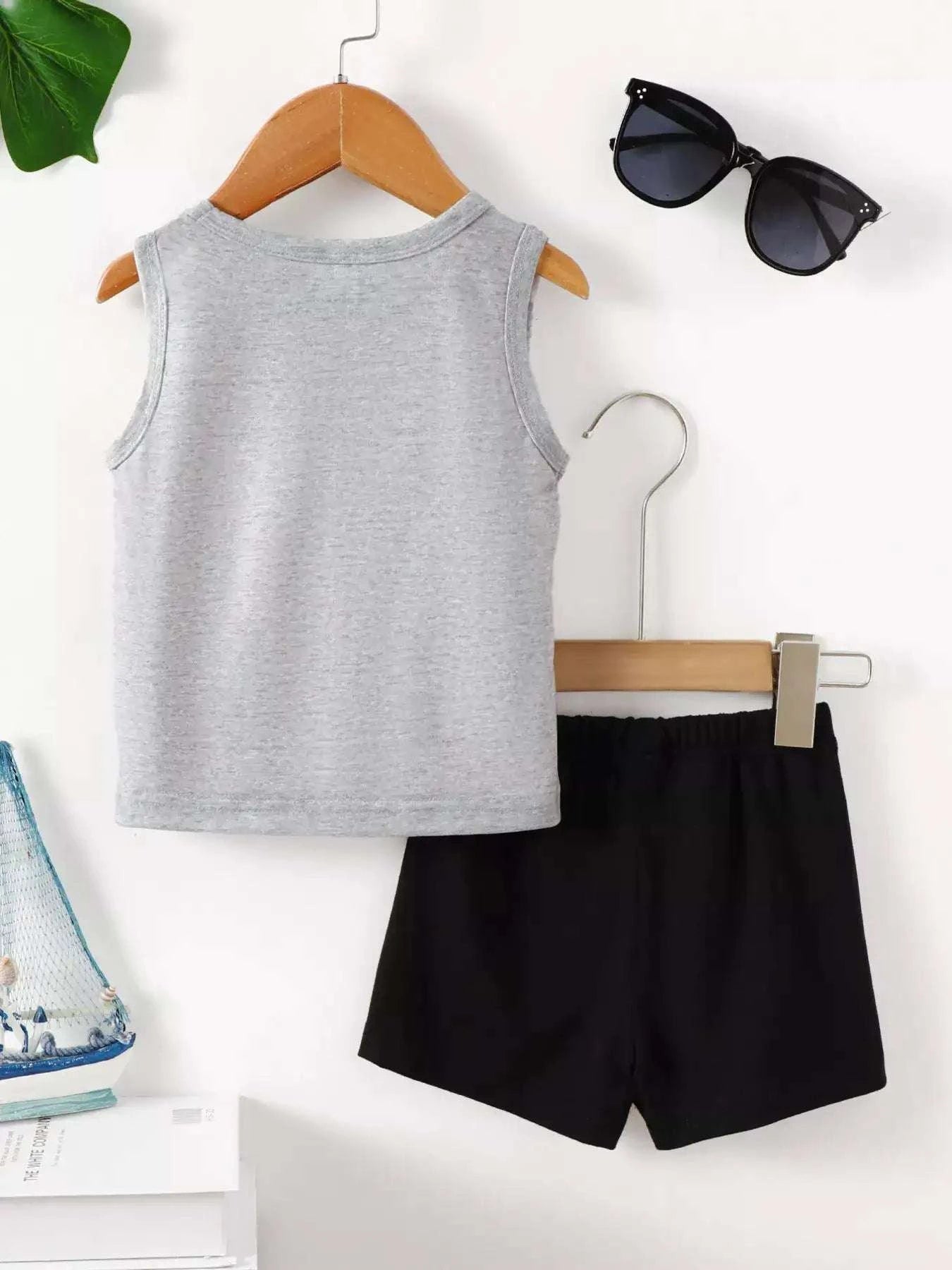 Kids shark graphic tank top and shorts set with gray sleeveless tank and black shorts.
