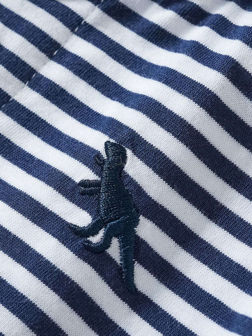Children's striped polo shirt with small embroidered dinosaur on navy-and-white stripes