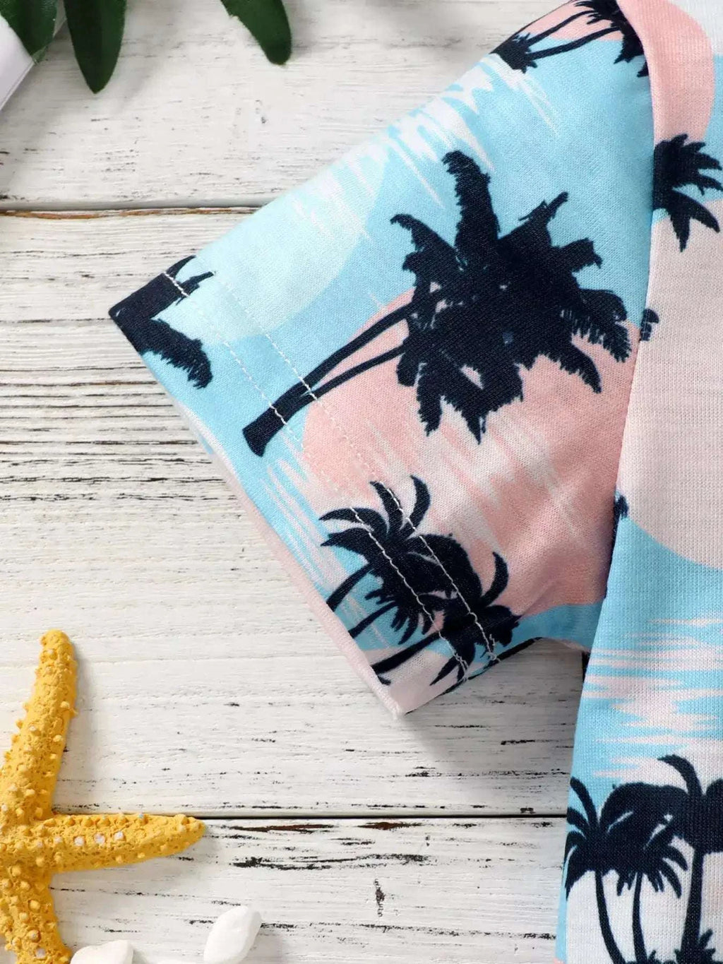 Kids palm print tee sleeve with light blue and pink palm pattern