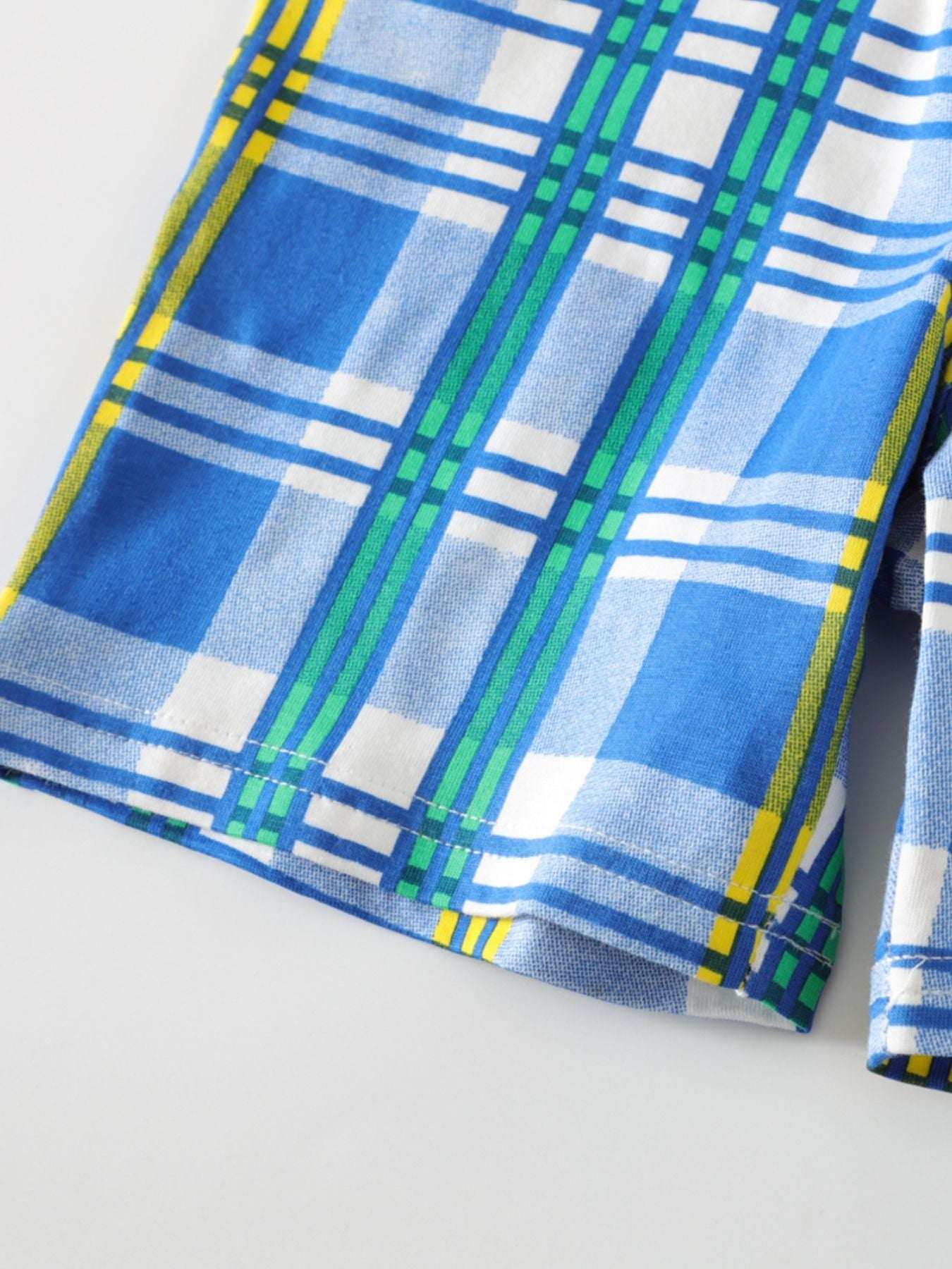 Blue plaid shorts with vertical and horizontal stripe pattern
