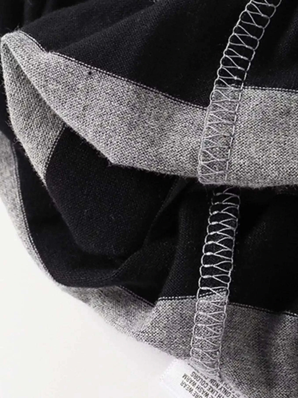 Children's striped shorts, black fabric with light gray elastic waistband and seams