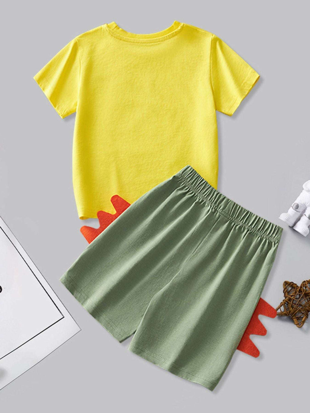 Yellow dinosaur graphic tee and green shorts set with elastic waistband