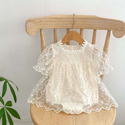Cream baby lace romper dress with ruffled short sleeves and scalloped neckline