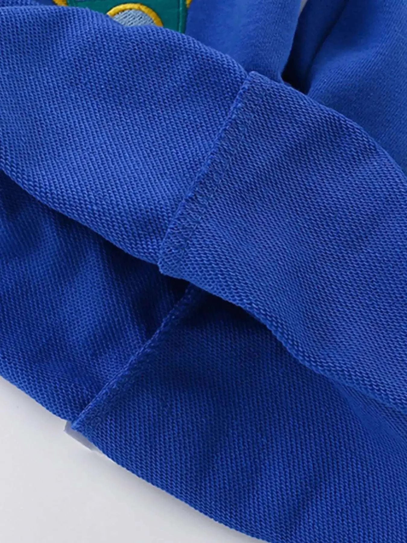 Blue kids shorts with smooth woven fabric and visible seam