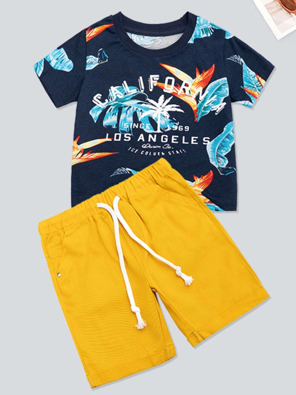 Kids printed short-sleeve tee and shorts set, navy tropical graphic and yellow shorts