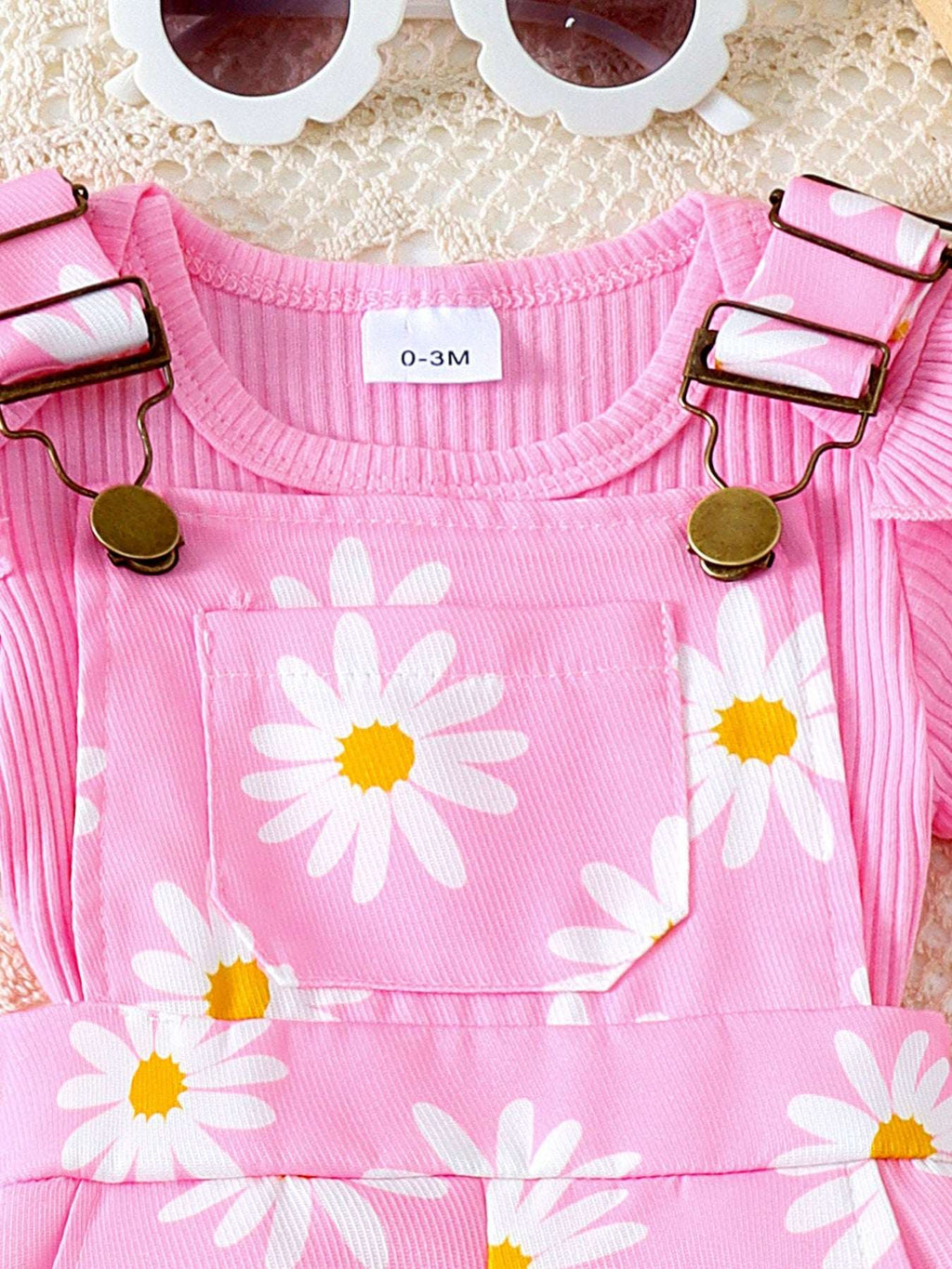 Pink ribbed ruffle-sleeve top with daisy print front and snap-on shoulder straps