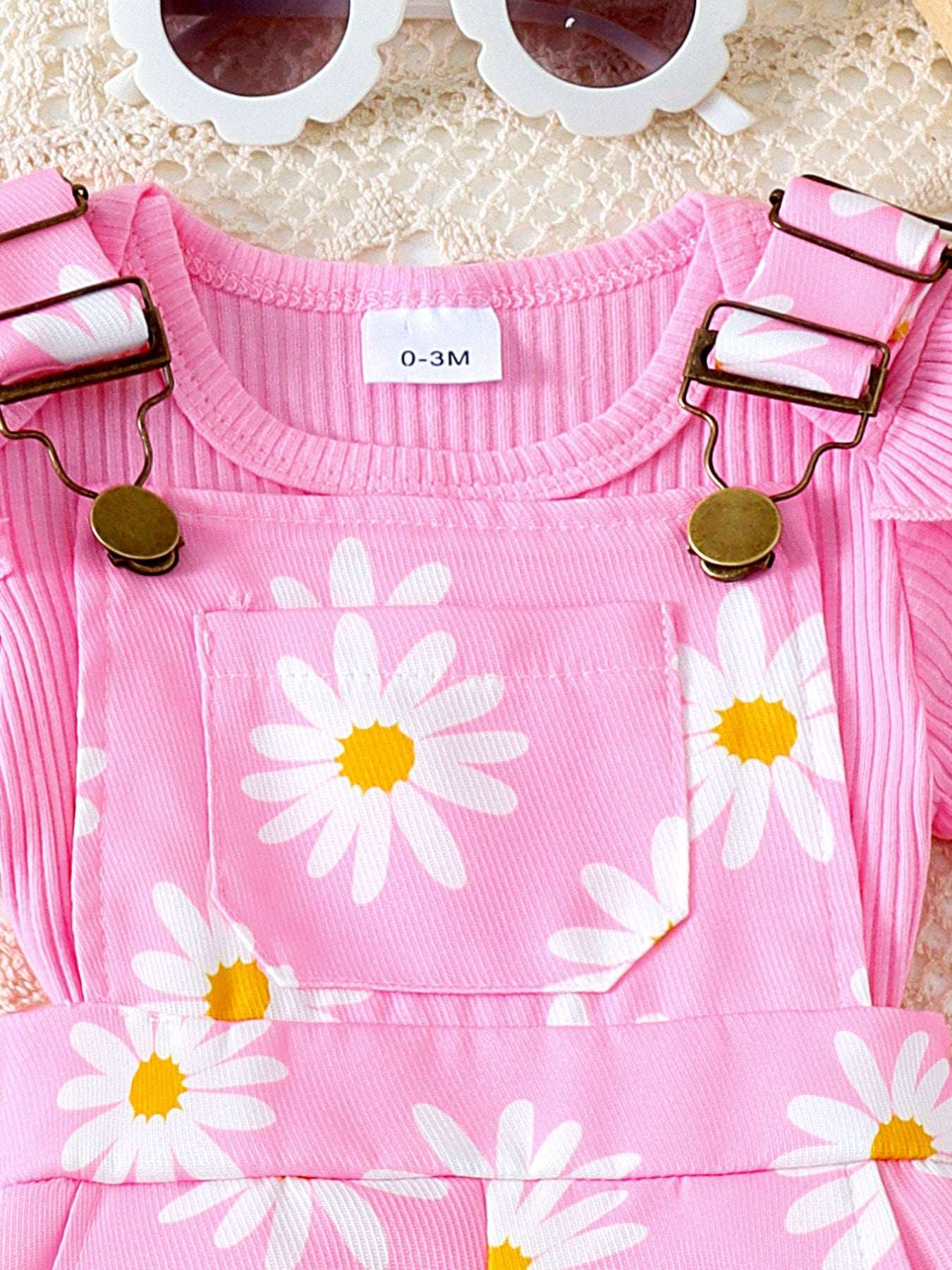 Pink ribbed ruffle-sleeve top with daisy print front and snap-on shoulder straps