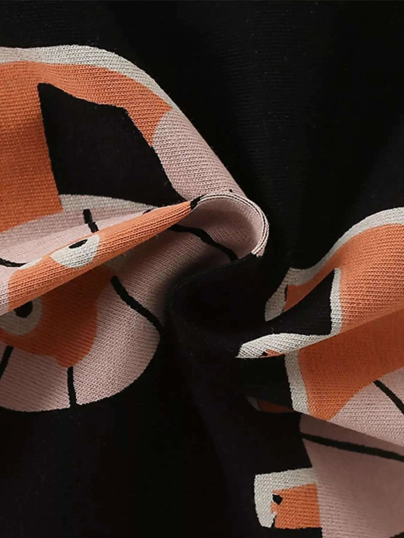 Lion print fabric detail on kids tee and shorts set, black with orange stripes