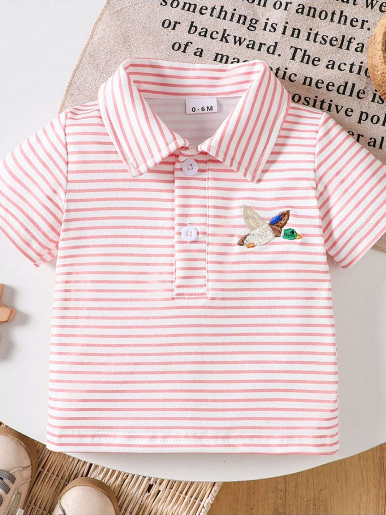 Pink striped children’s duck polo shirt with embroidered duck on the chest