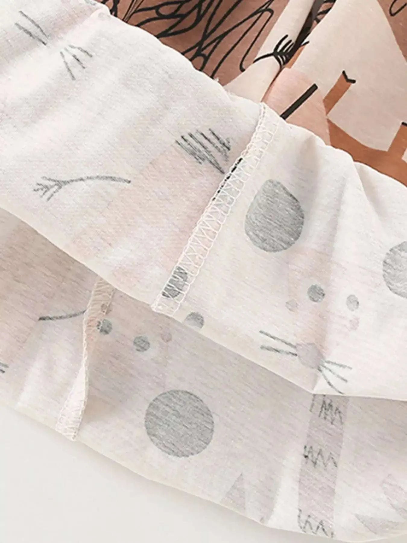 Children's animal print shorts with light gray dot pattern