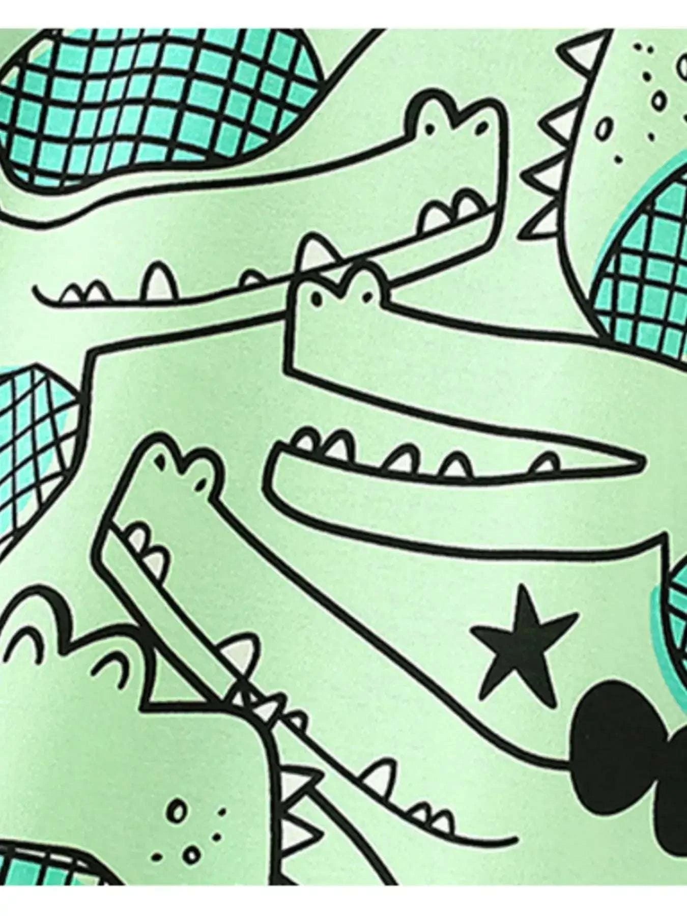 Crocodile print on mint green kids T-shirt front, featuring black stars and scales