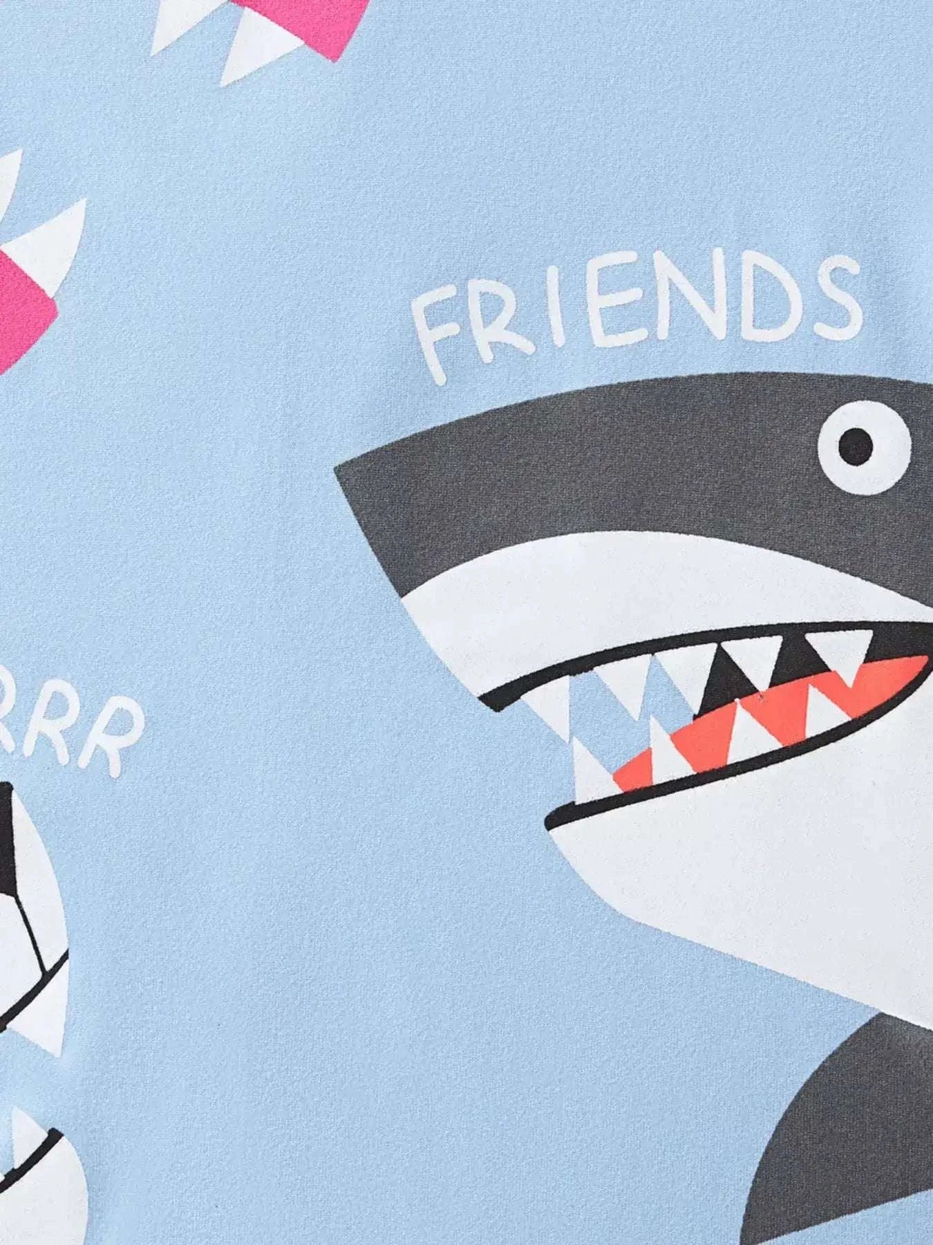 Light blue crew neck T-shirt with shark cartoon and 'FRIENDS' lettering