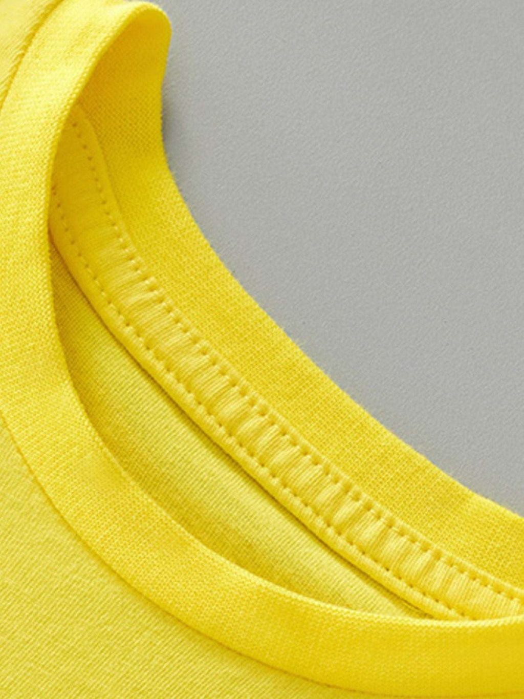 Yellow crew-neck tee close-up with ribbed collar stitching