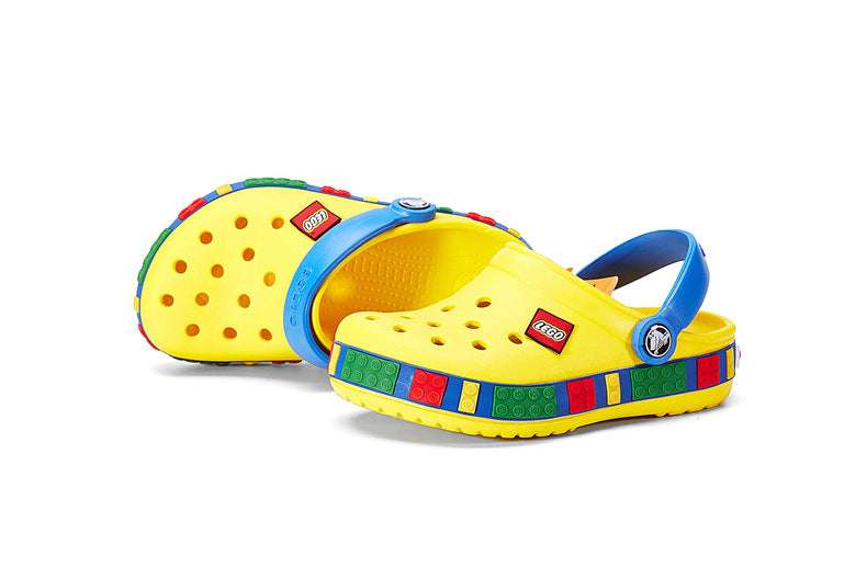 Kids’ slip-on hollow clogs, yellow and blue with perforated holes and multicolor trim