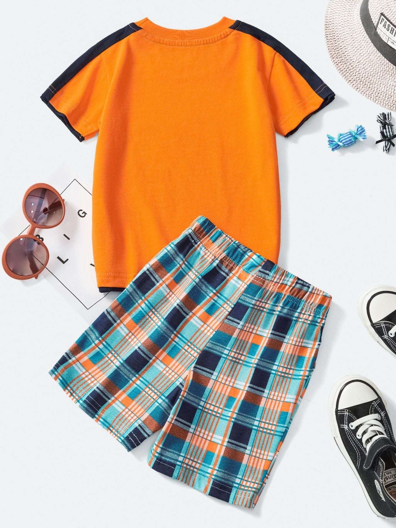 Children's tee and shorts set with orange short-sleeve top and blue plaid shorts