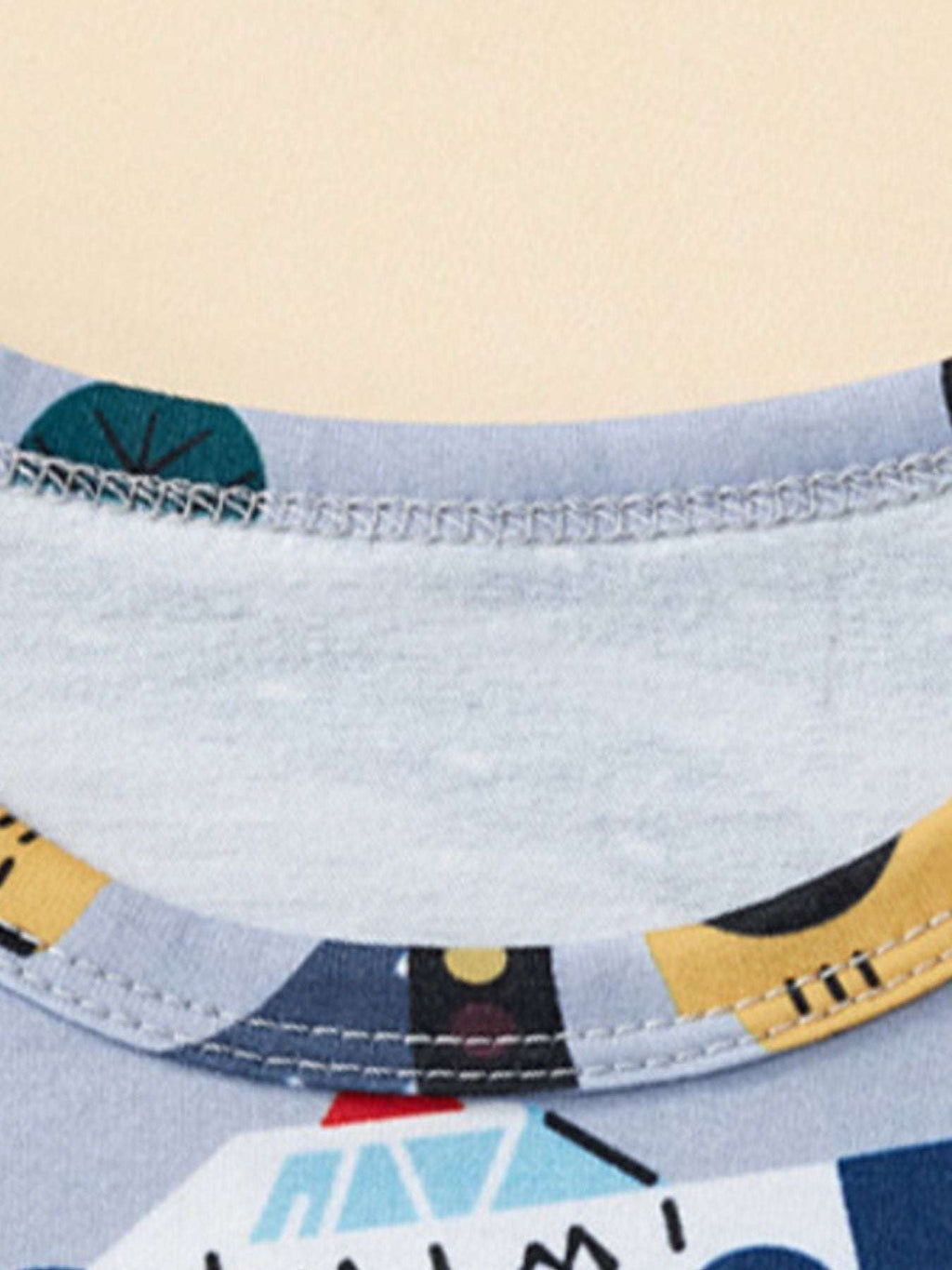 Dusty blue shorts with construction-vehicle print and elastic waistband hem