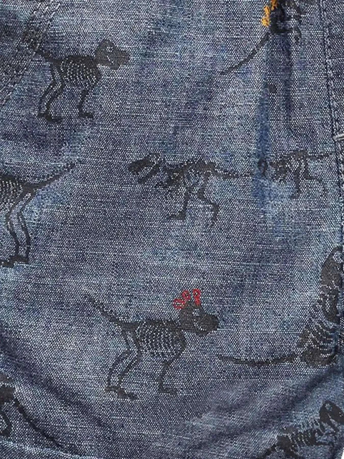 Blue woven shorts with allover dinosaur print
