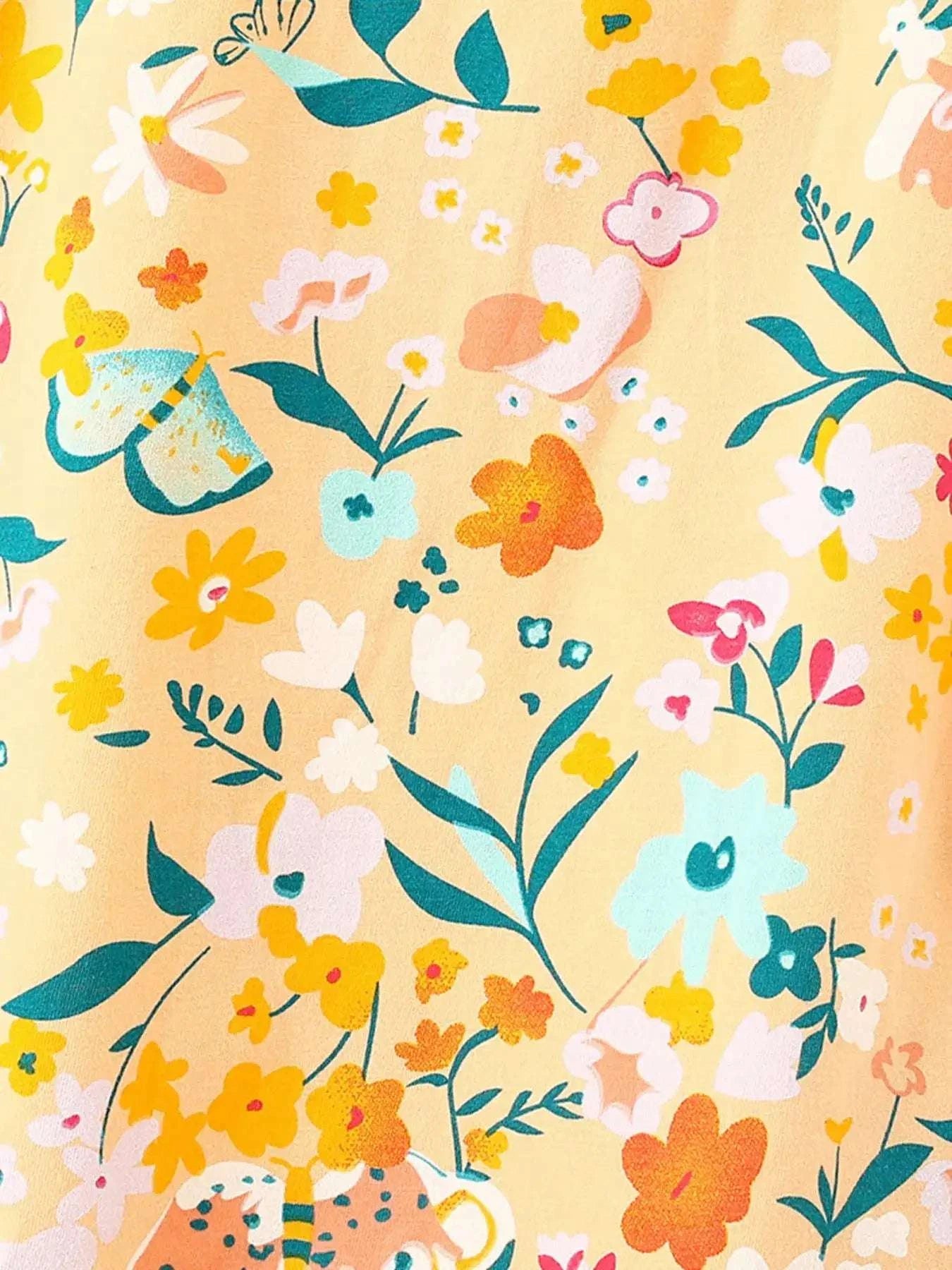 Kids floral print shorts fabric detail in yellow-gold with colorful flowers and leaves