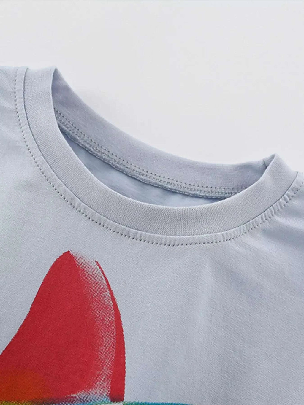 Light gray kids shark print crewneck tee, red fin graphic at chest