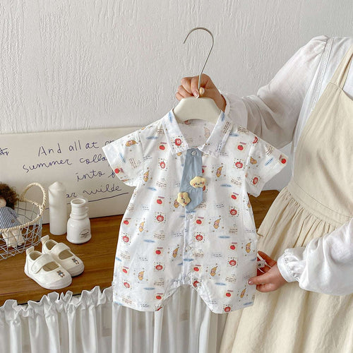 White baby romper with short sleeves, button front, allover colorful cartoon prints