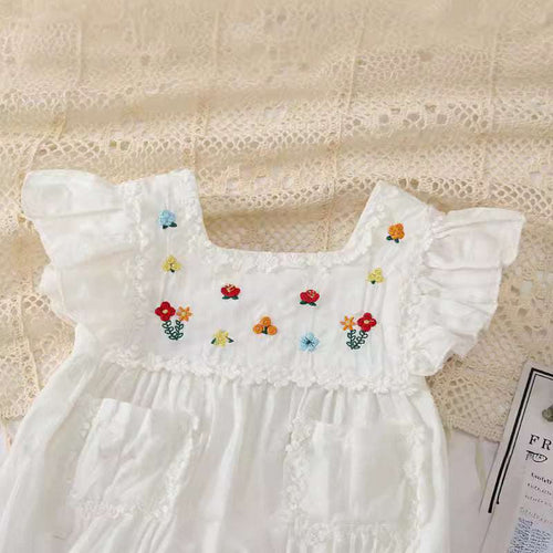 White baby girl romper with flutter sleeves, multicolor flower embroidery and ruffled yoke