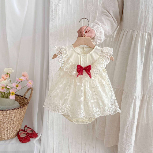 Apricot lace newborn romper bodysuit with puff sleeves and red bow at chest