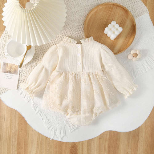 Cream baby lace romper dress with button placket and gathered tulle skirt