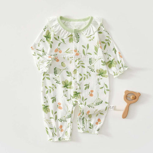 White baby short-sleeve jumpsuit with leafy floral print and green-trim ruffle collar