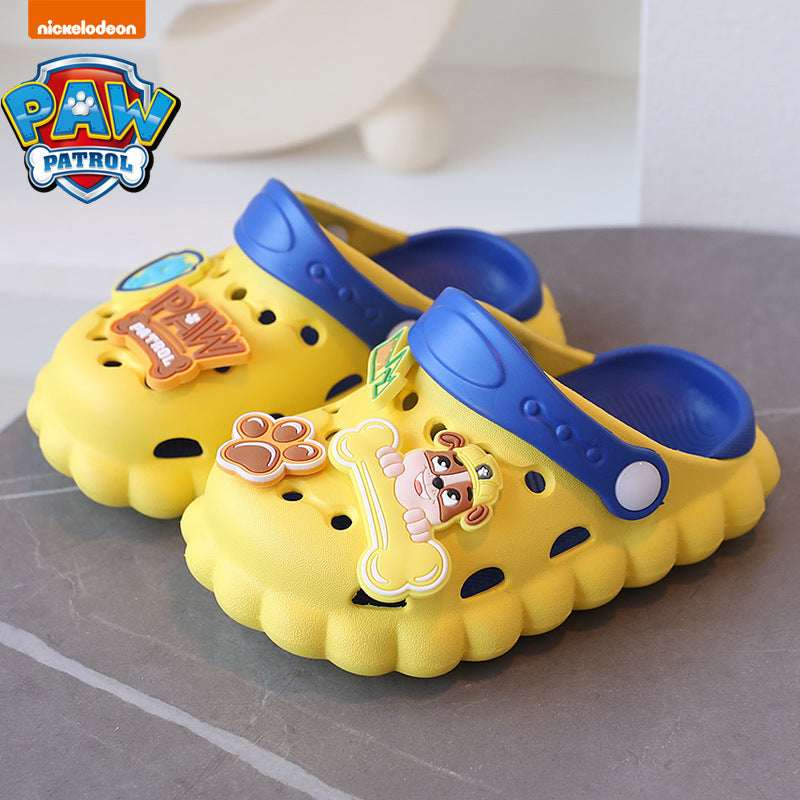 Kids' croc-style Paw Patrol slippers, yellow with blue tops and paw print patch, dog face.