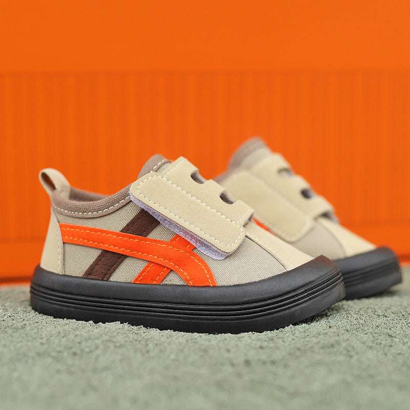 Kids canvas sneakers in cream with orange side stripe and Velcro closure