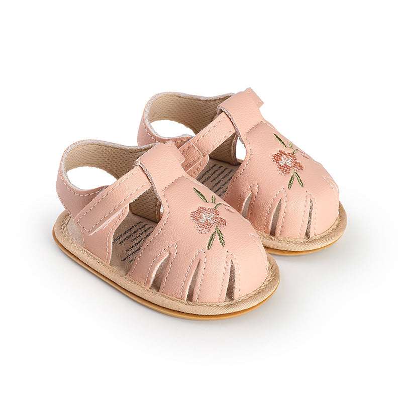 Light pink infant baby walking sandals with floral embroidery and secure strap closure