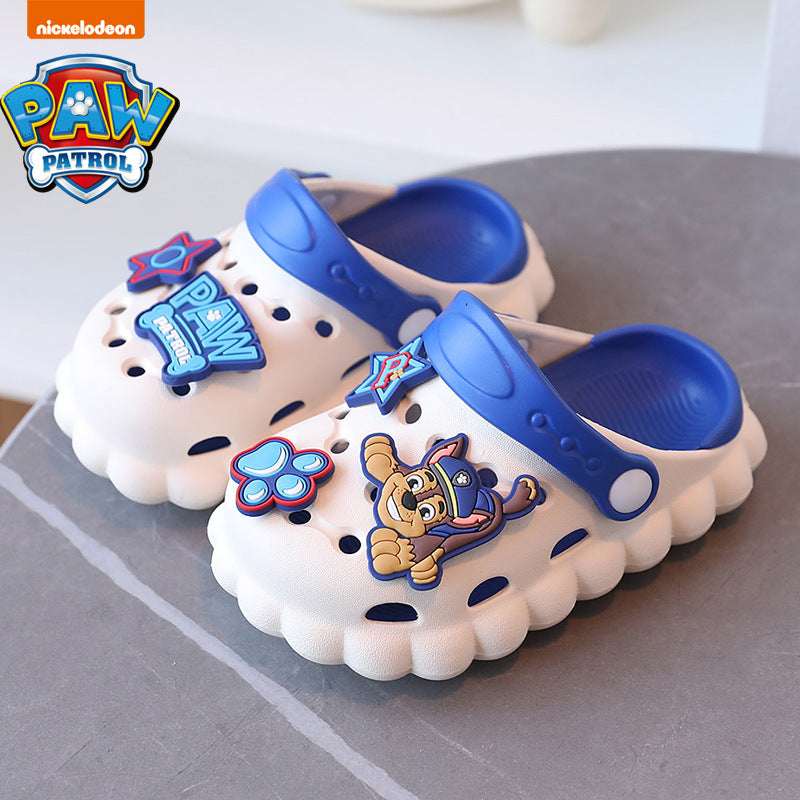 Kids' croc-style Paw Patrol slippers, white with blue tops and paw print patches, dog face.