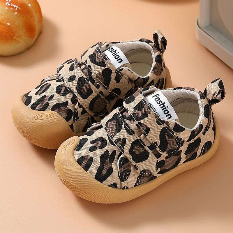 Leopard print cloth toddler shoes with hook-and-loop straps and tan non-slip sole