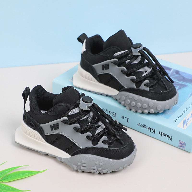 Kids chunky sneakers, black with white soles and gray lace-up panels