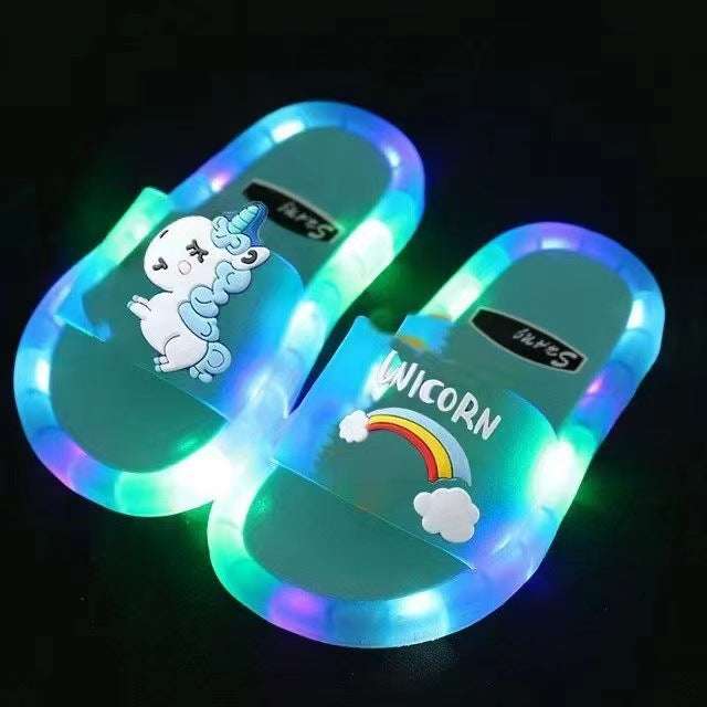 Light blue light-up unicorn slides with rainbow cloud graphic and LED border