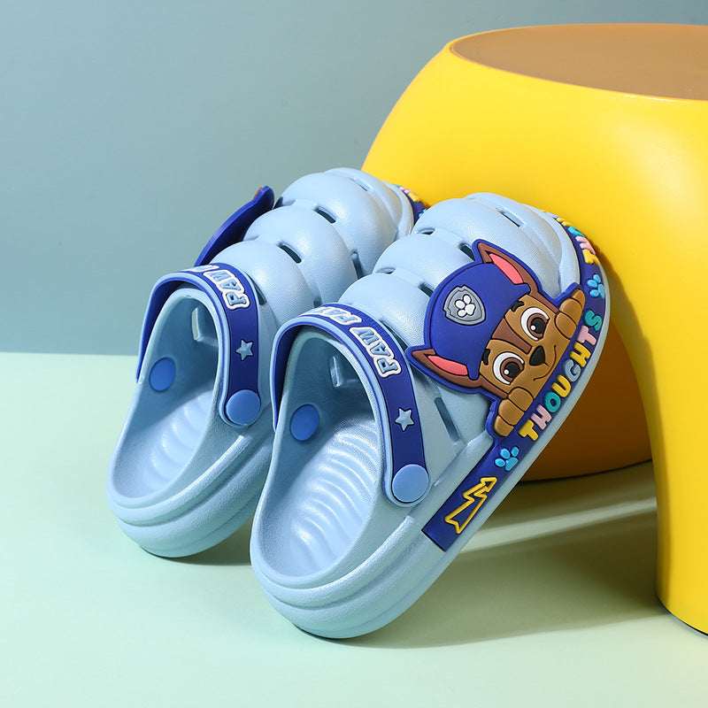 Kids' croc-style Paw Patrol slippers, light blue clogs with Paw Patrol strap and dog graphic.
