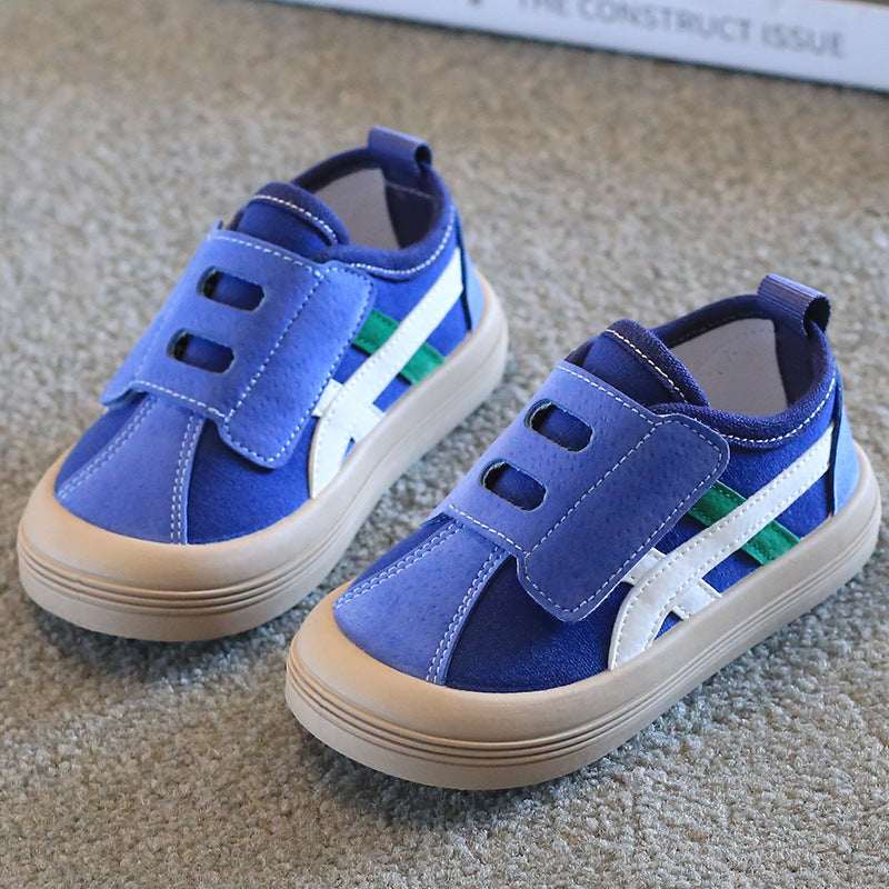 Kids canvas sneakers in light blue with Velcro straps and white/green side stripes