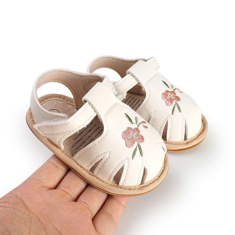Infant white baby walking shoes with floral embroidery and adjustable hook-and-loop strap