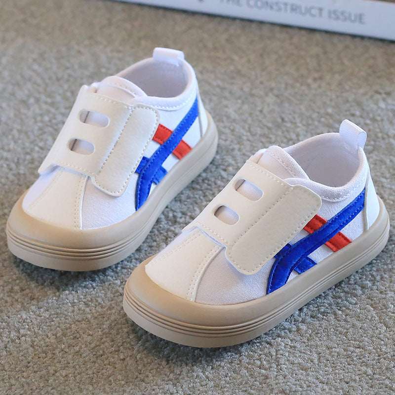 Kids canvas sneakers, white with blue stripe and red velcro strap, soft sole.
