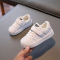 Kids low-top sneakers, all-white with hook-and-loop strap and textured sole