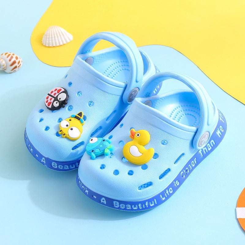Kids’ light blue slip-on clogs with duck and mouse cartoon decals and perforations