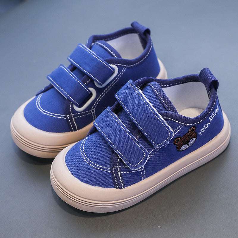 Kids canvas sneakers in blue with Velcro straps and stitched sidewall details
