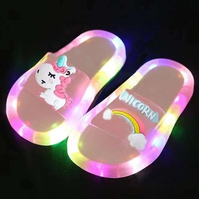 Light pink light-up unicorn slides with rainbow cloud graphic and multicolor LEDs