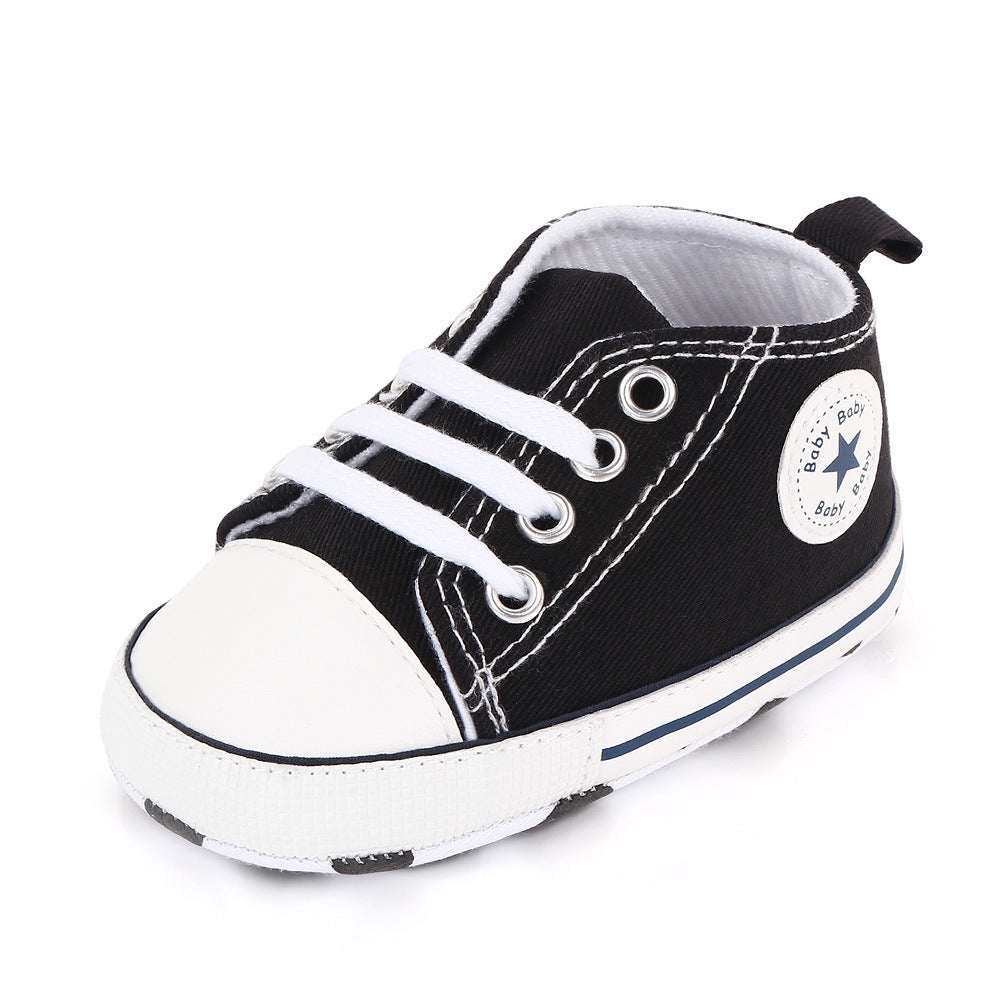 Toddler canvas sneakers, black with white toe and stripes, lace-up soft sole star patch