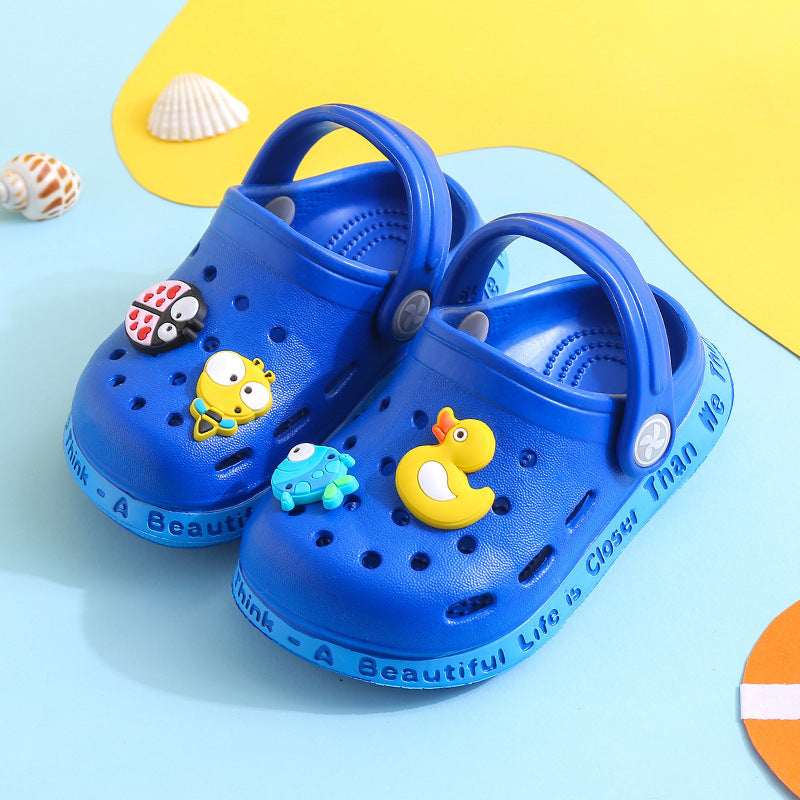 Kids’ blue slip-on clogs with duck and chick cartoon charms, perforated upper