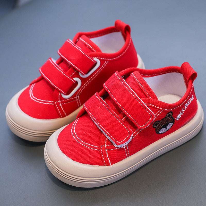Kids canvas sneakers in red with Velcro straps and stitched toe and side seams