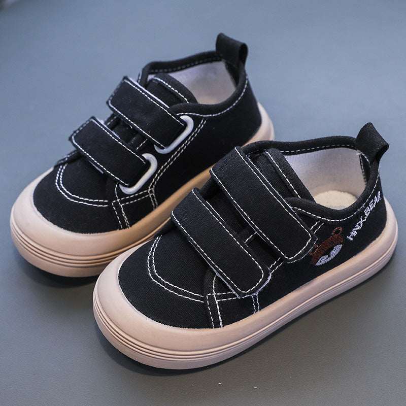 Kids canvas sneakers in black with Velcro straps and stitched sidewall lines
