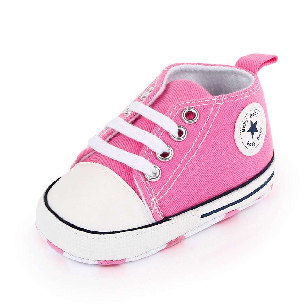 Pink canvas baby sneakers with star heel patch, lace-up soft sole