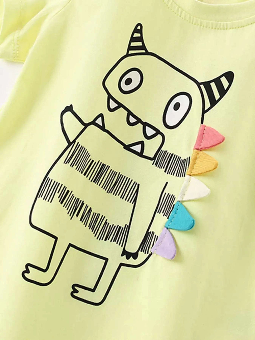 Light yellow kids T-shirt with cute cartoon monster graphic on front